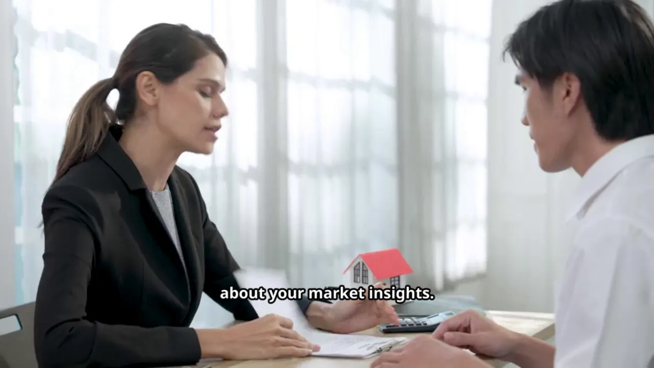 Agent explaining market insights over documents to a valuer with a small house model on the desk