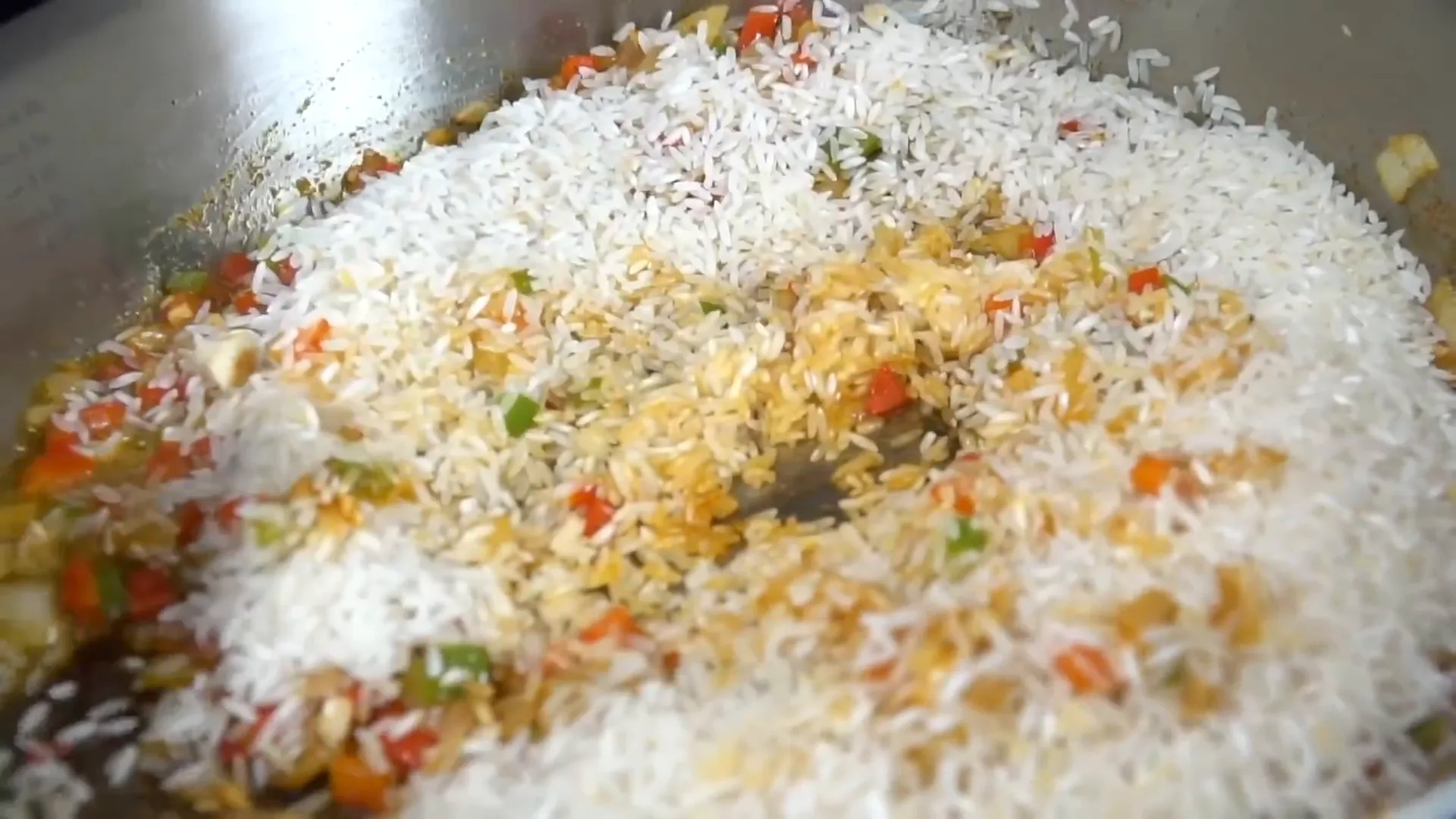 Adding rice to skillet