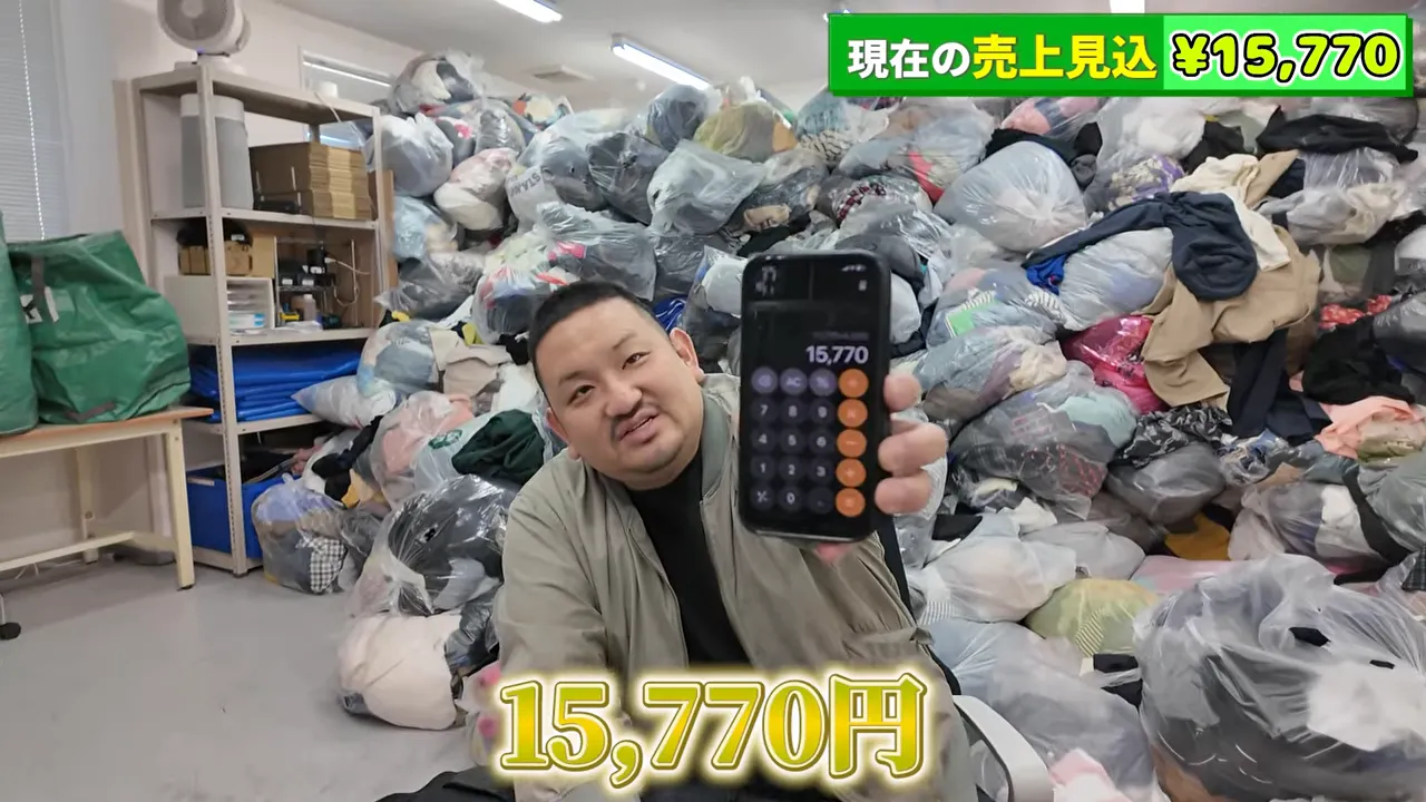 スマートフォンの電卓画面に15770と表示され、見込み売上が示されている