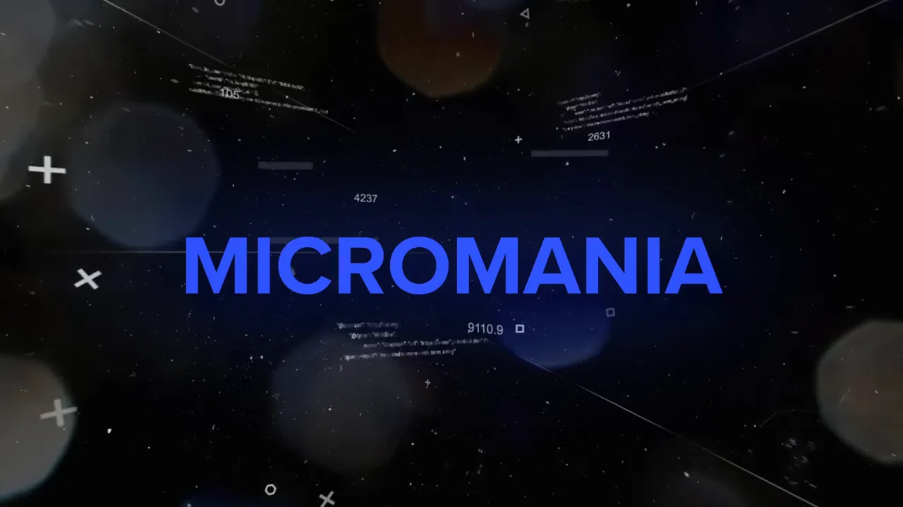 Carte-titre bleu « MICROMANIA » sur fond sombre et effets graphiques.