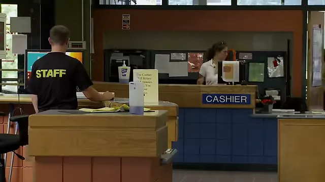 Staff at the cashier desk assisting patrons