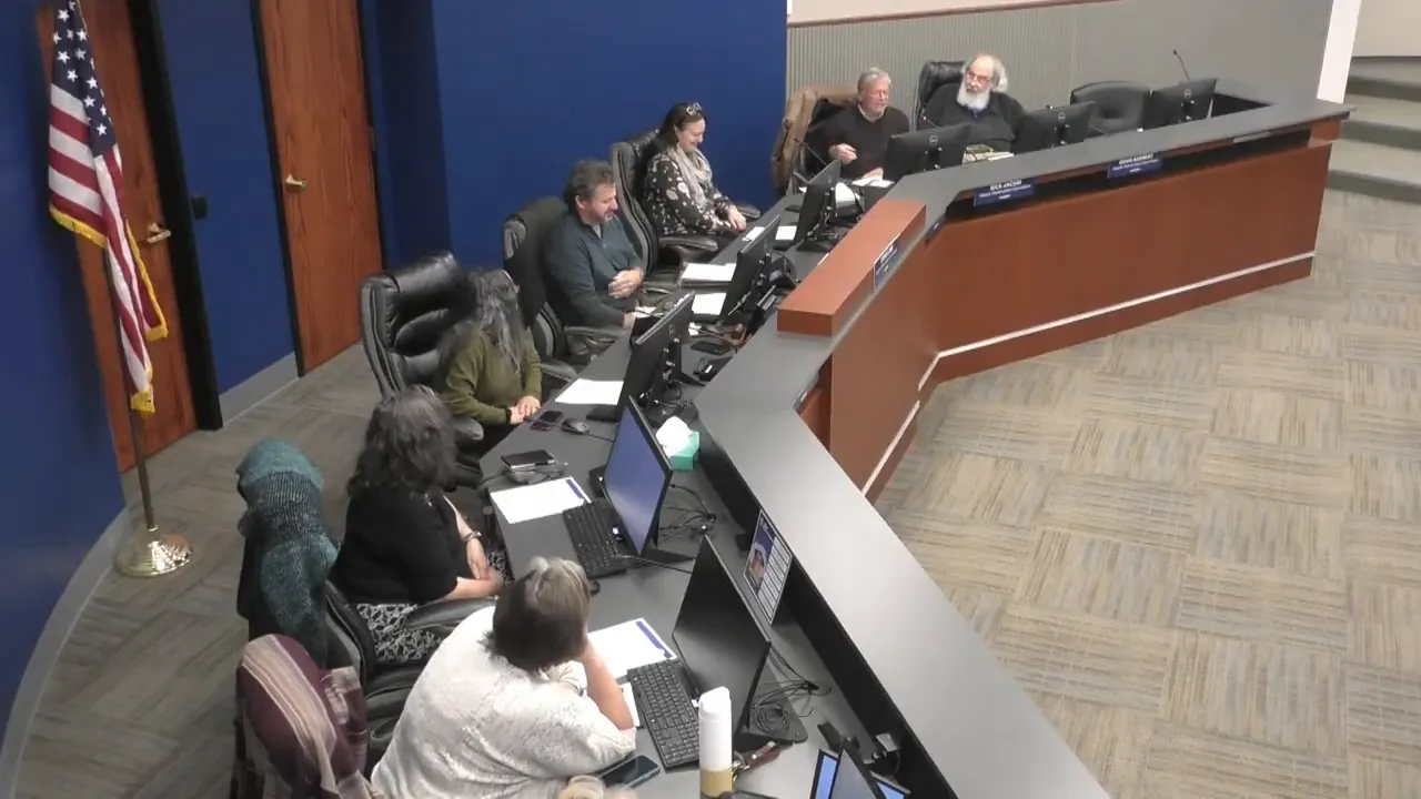 High-resolution overhead shot of the Historic Preservation Commission at the dais, showing multiple commissioners and staff at work.