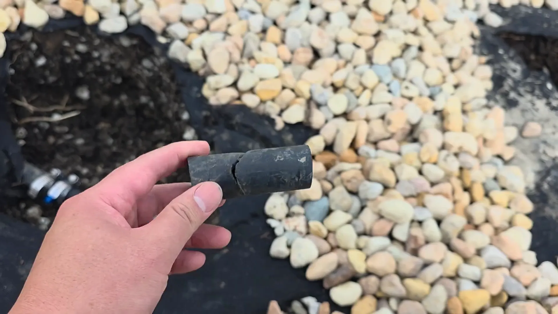 Broken sprinkler pipe found during backyard fix
