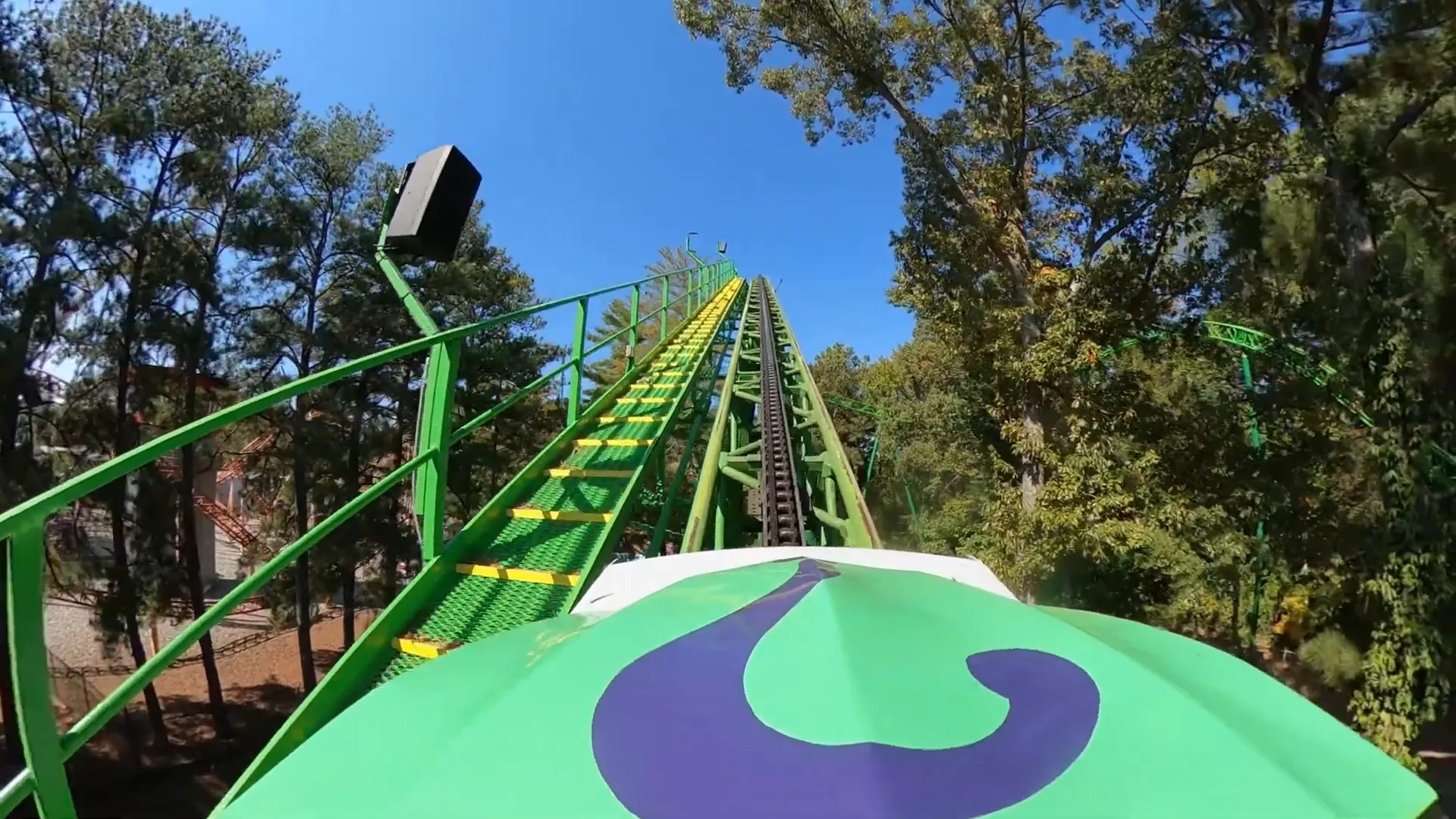 Mindbender purple train climbing lift hill