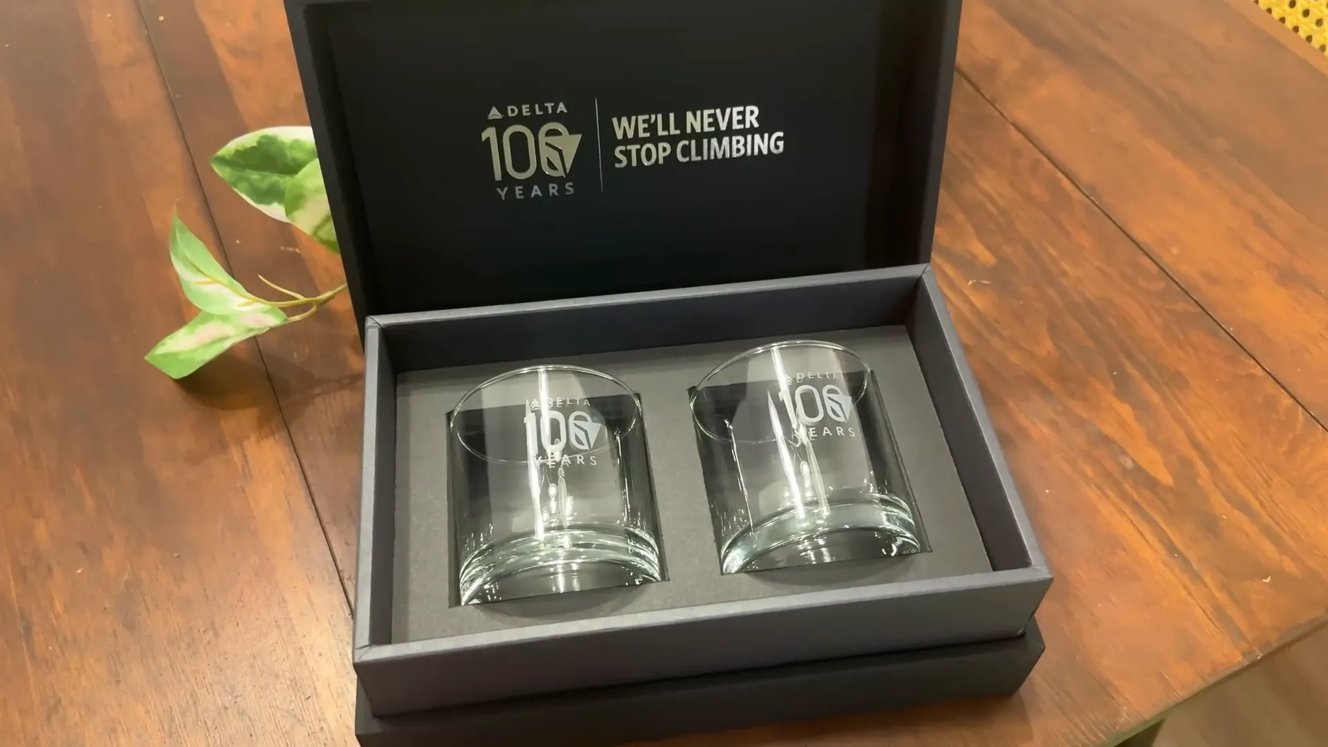 Delta memorabilia including a whiskey glass and trading cards