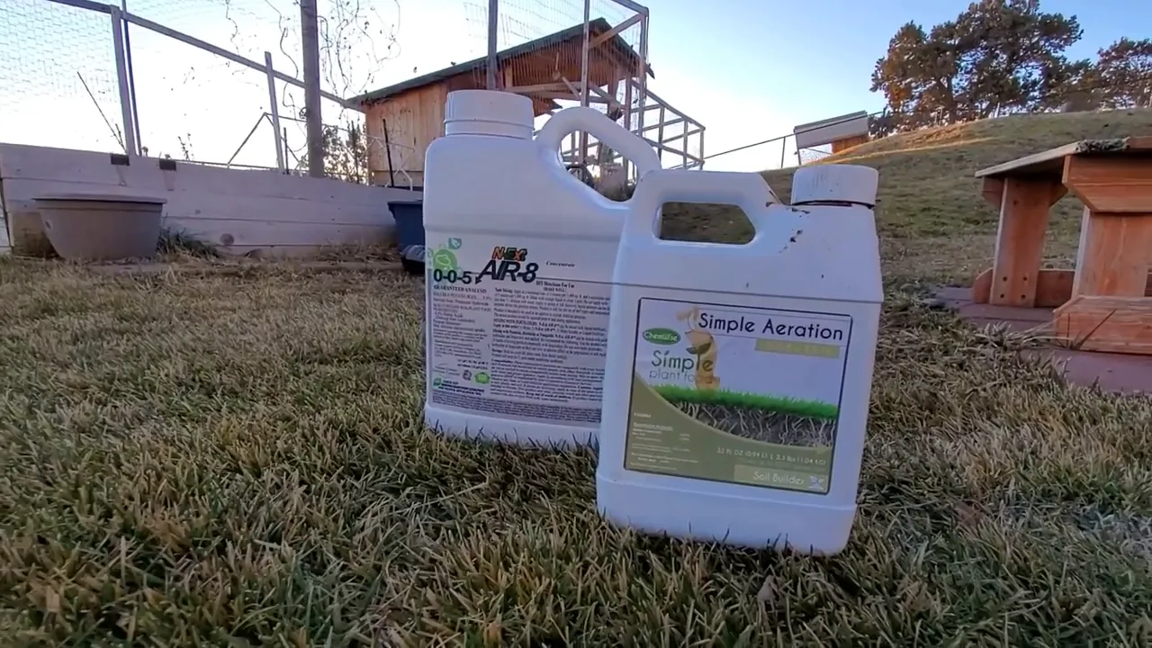 Liquid aeration product containers lined up on a lawn