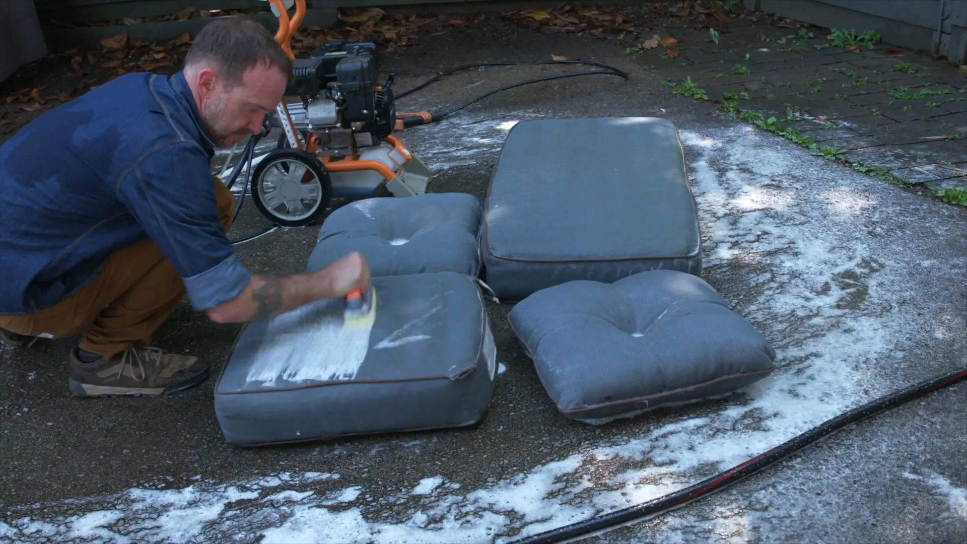 Scrubbing stubborn stains on outdoor cushions