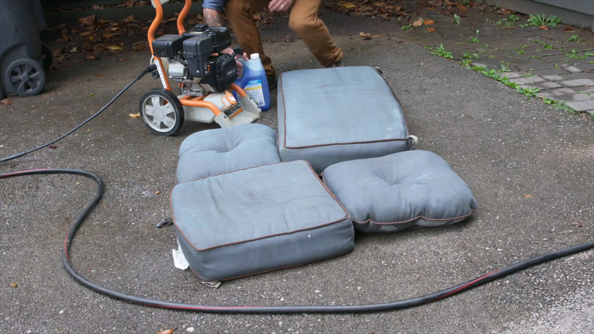 Preparing to use a pressure washer on outdoor cushions