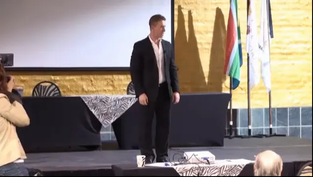 Douglas Kruger speaking on stage