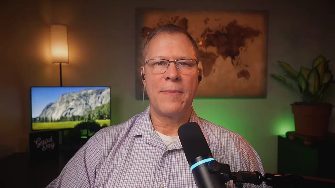 Bradley Charbonneau speaking into a podcast microphone on video about treating creativity as practice