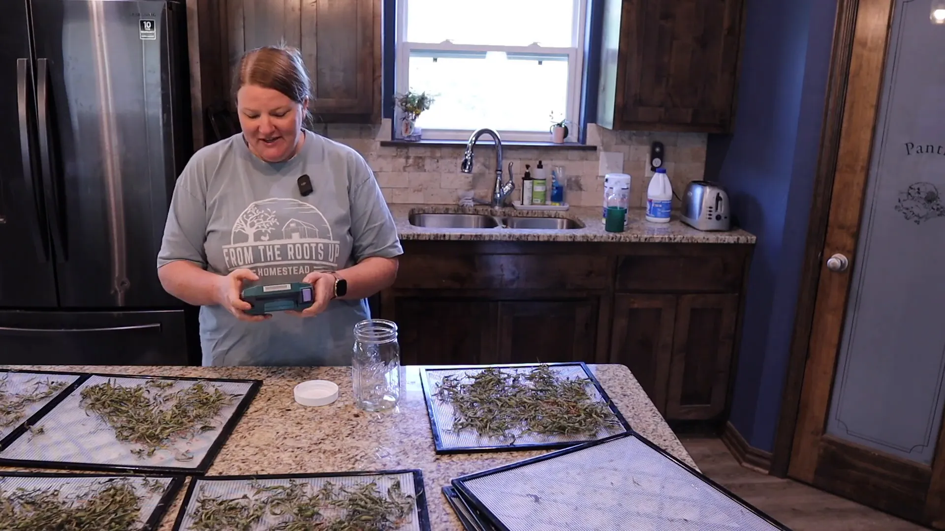 Storing dried bee balm in a mason jar