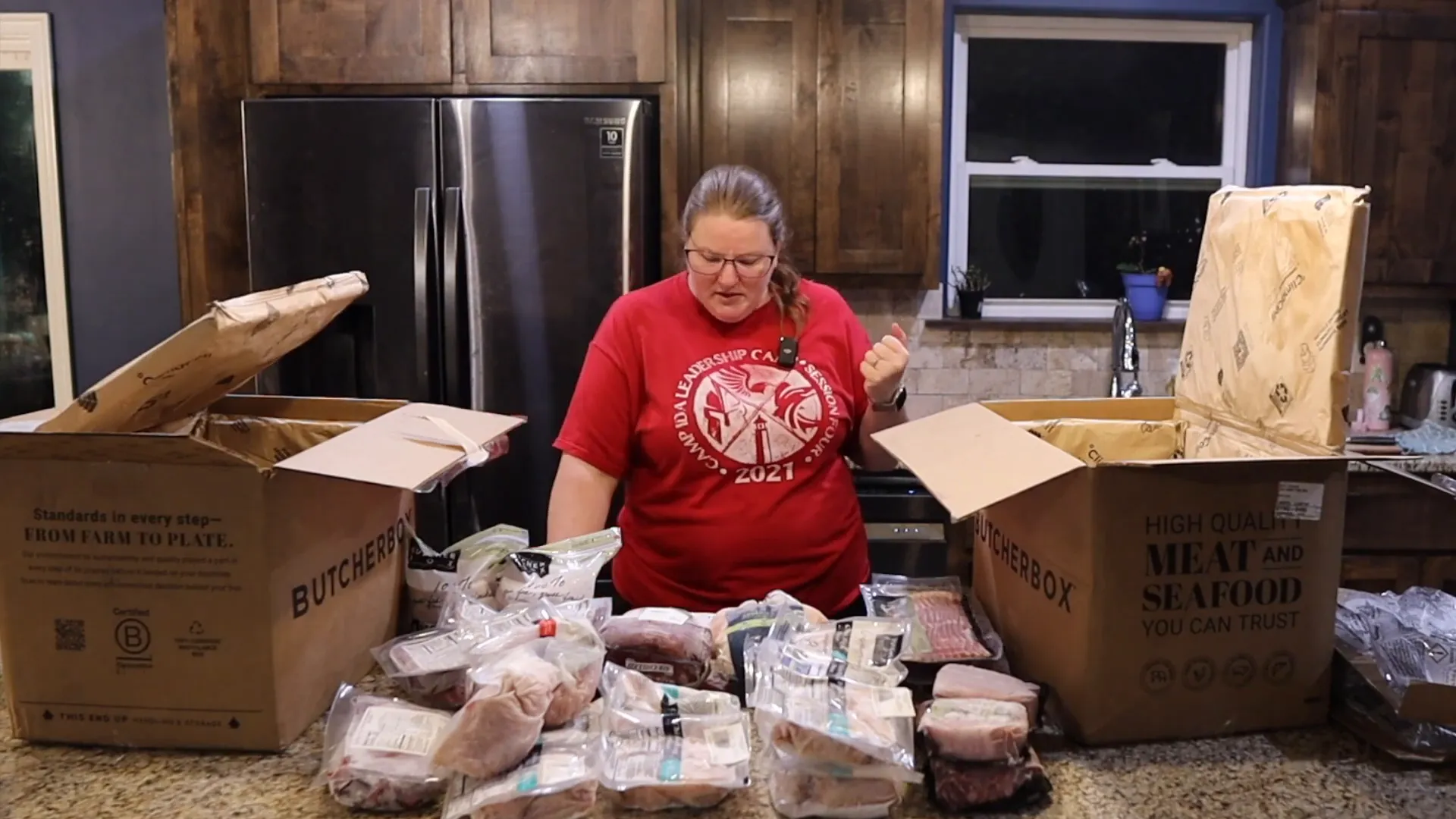 Woman reviewing the total cost comparison between ButcherBox and Whole Foods