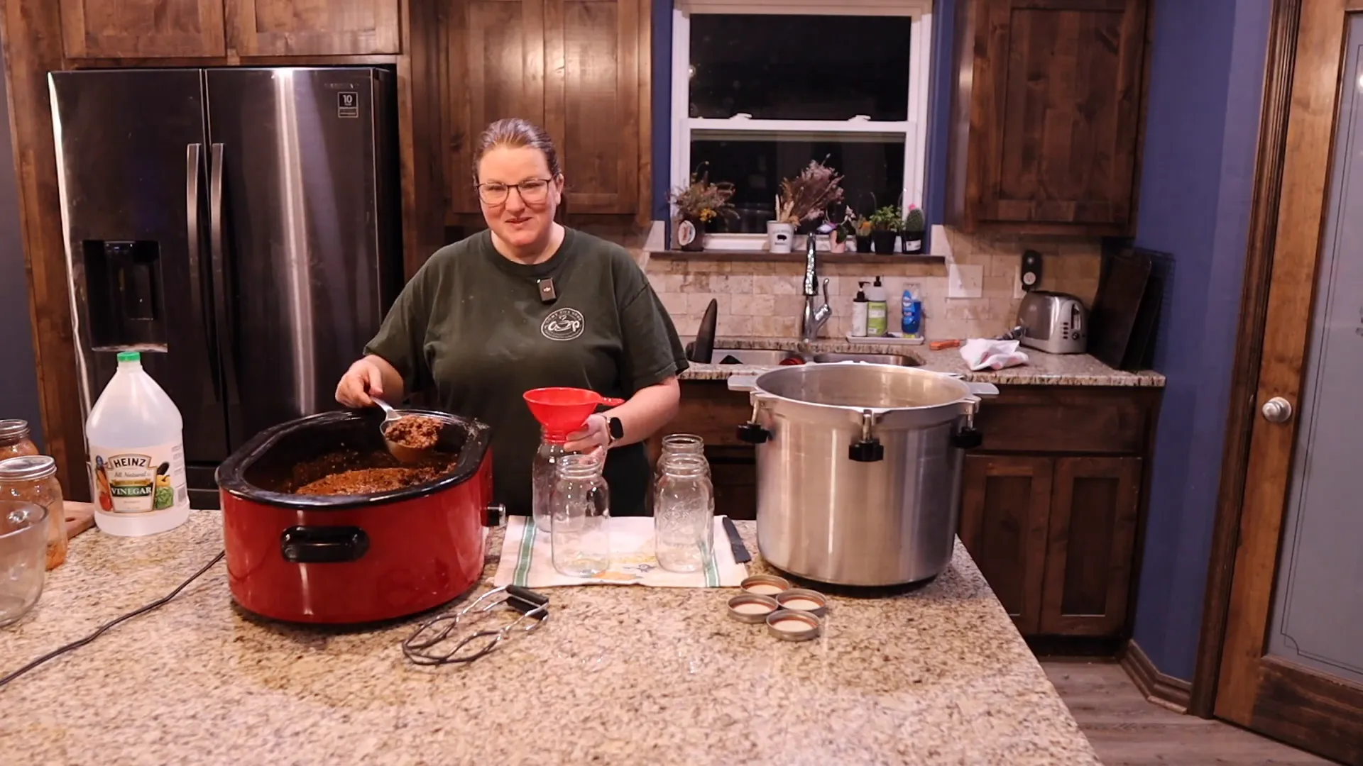 Filling jars to prepare for pressure canning chili