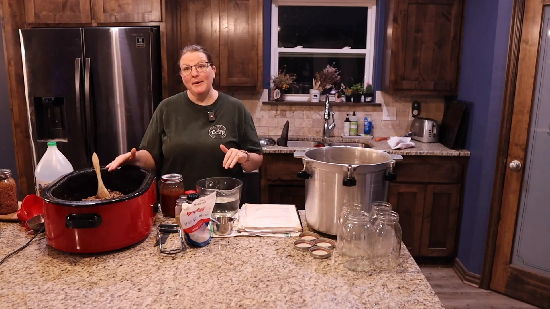 Cleaning the jar tops with vinegarto prepare for pressure canning chili