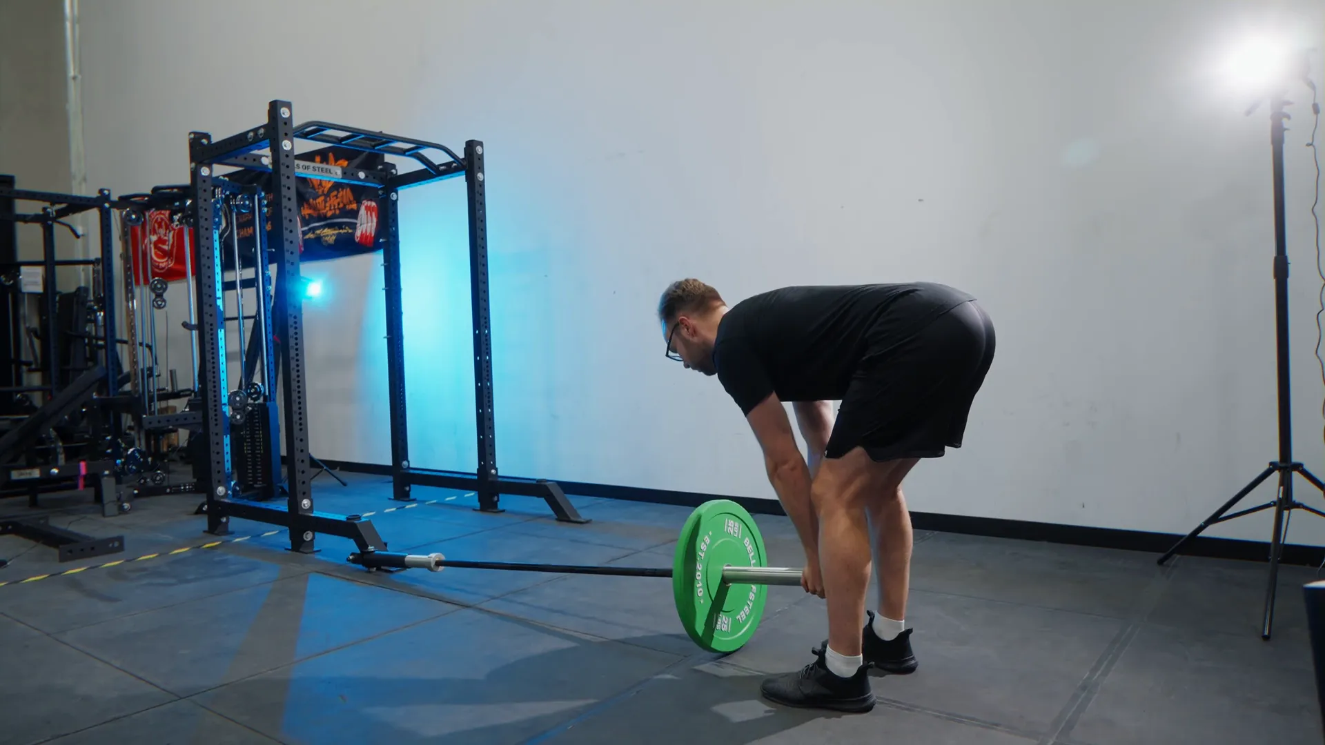 Athlete doing landmine squat with upright posture