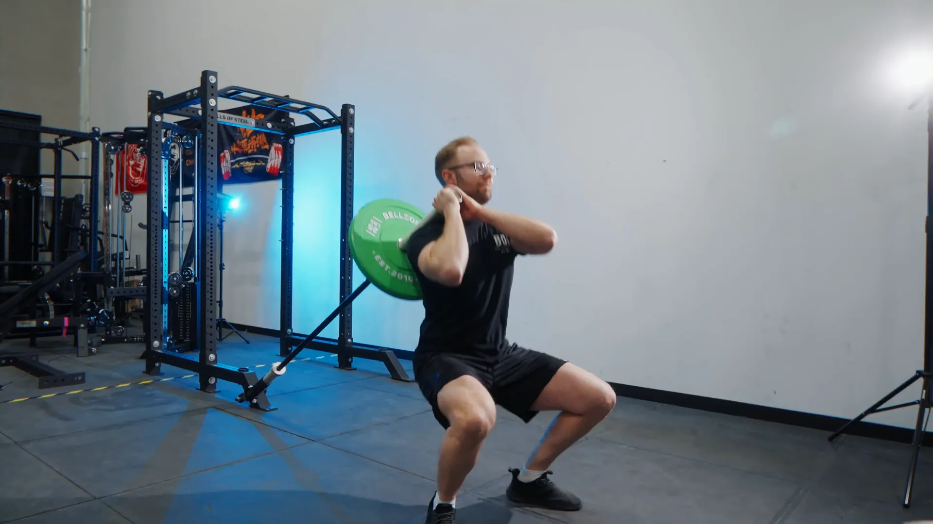 Athlete doing landmine squat with upright posture