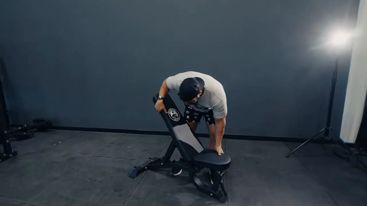 Close inspection of a home gym bench frame and seat during durability evaluation