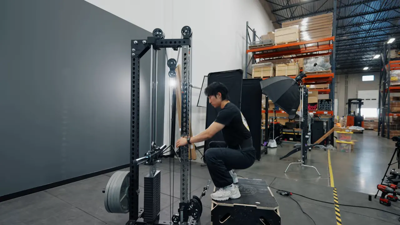 Belt squat belt attached to tower with box used for squats