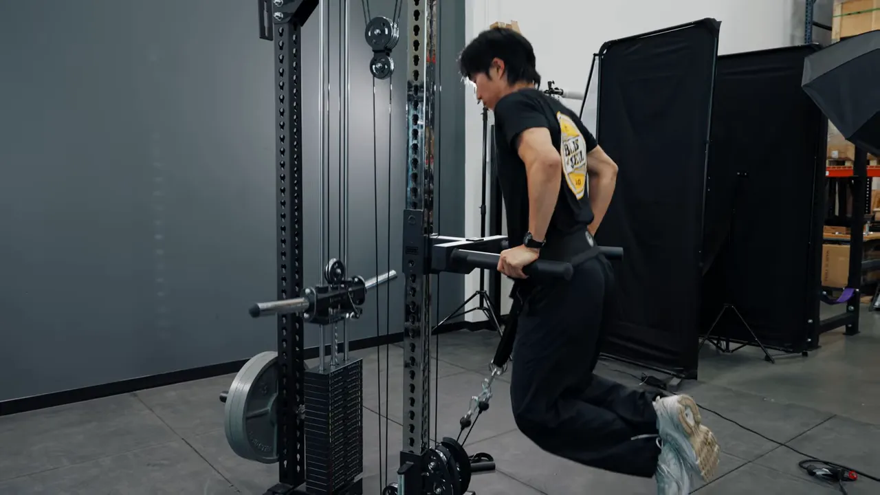 Wide dip bar attached to Oblivion tower with belt squat belt for weighted dips