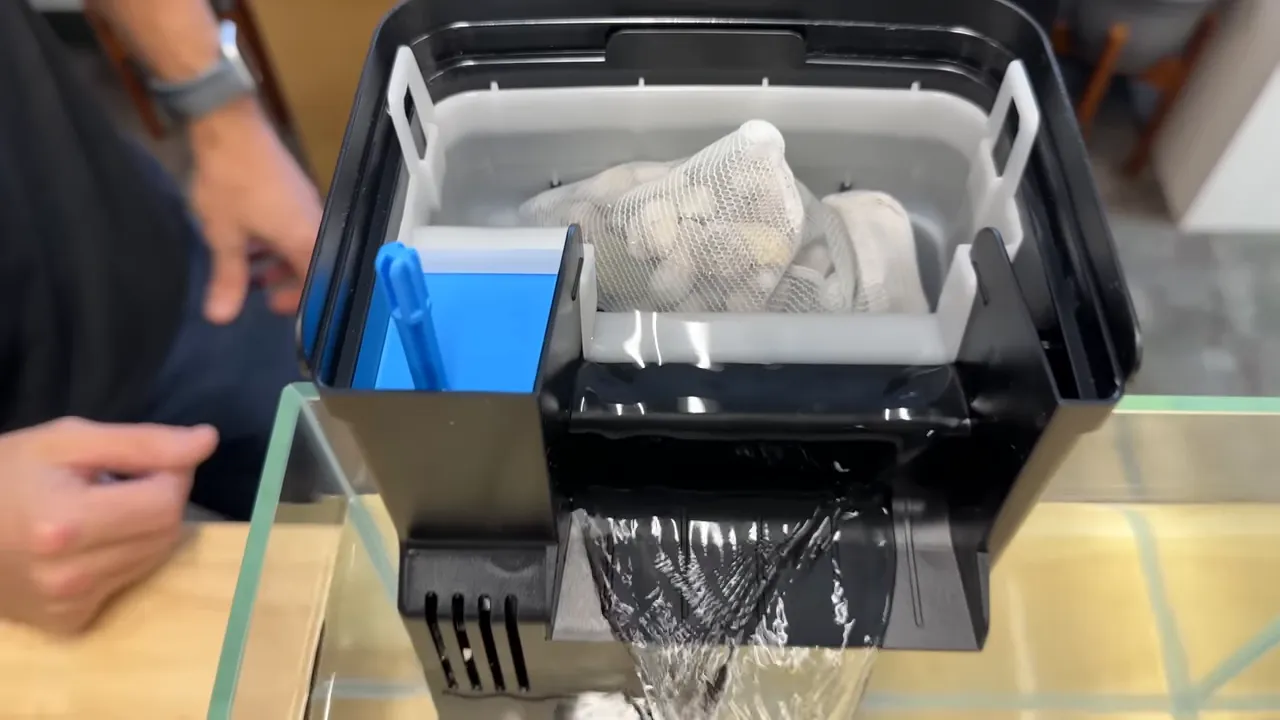 Hang-on-back filter returning water into a glass aquarium