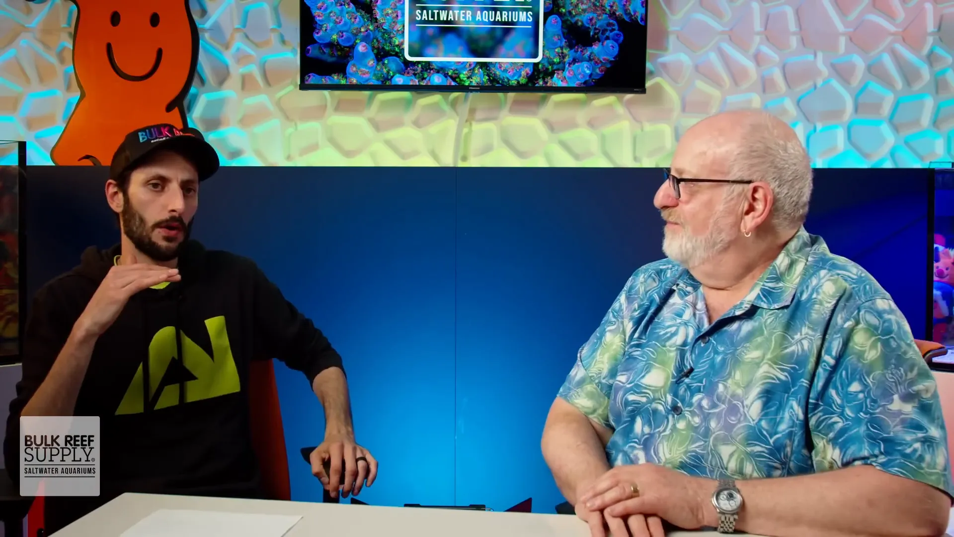 Lou and Thomas discussing reef tank maintenance