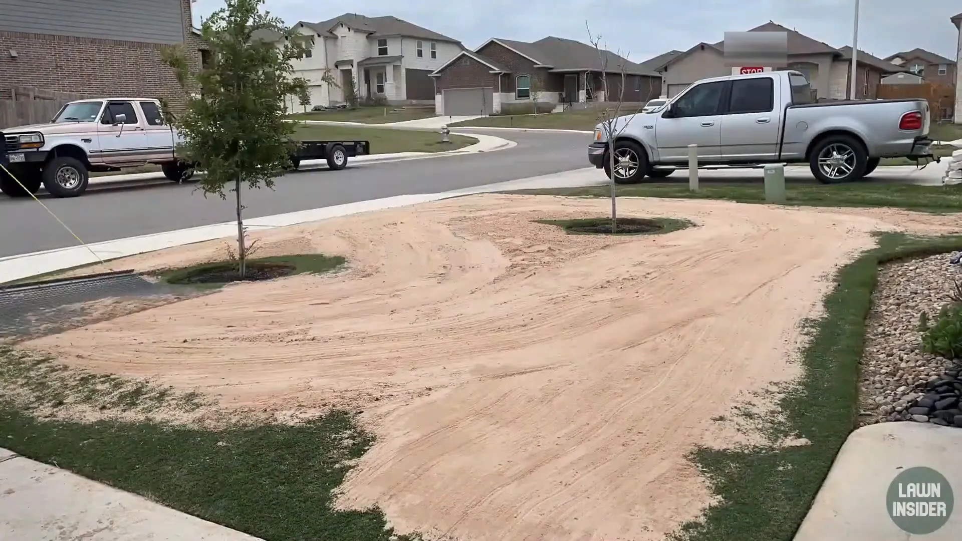 Dry spot along the sidewalk where grass is stressed