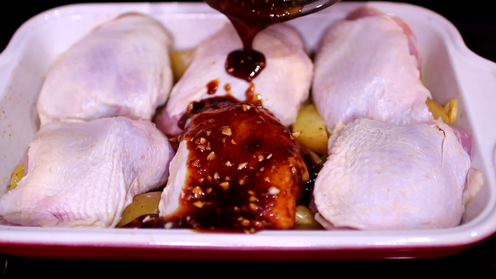 Placing chicken over potatoes