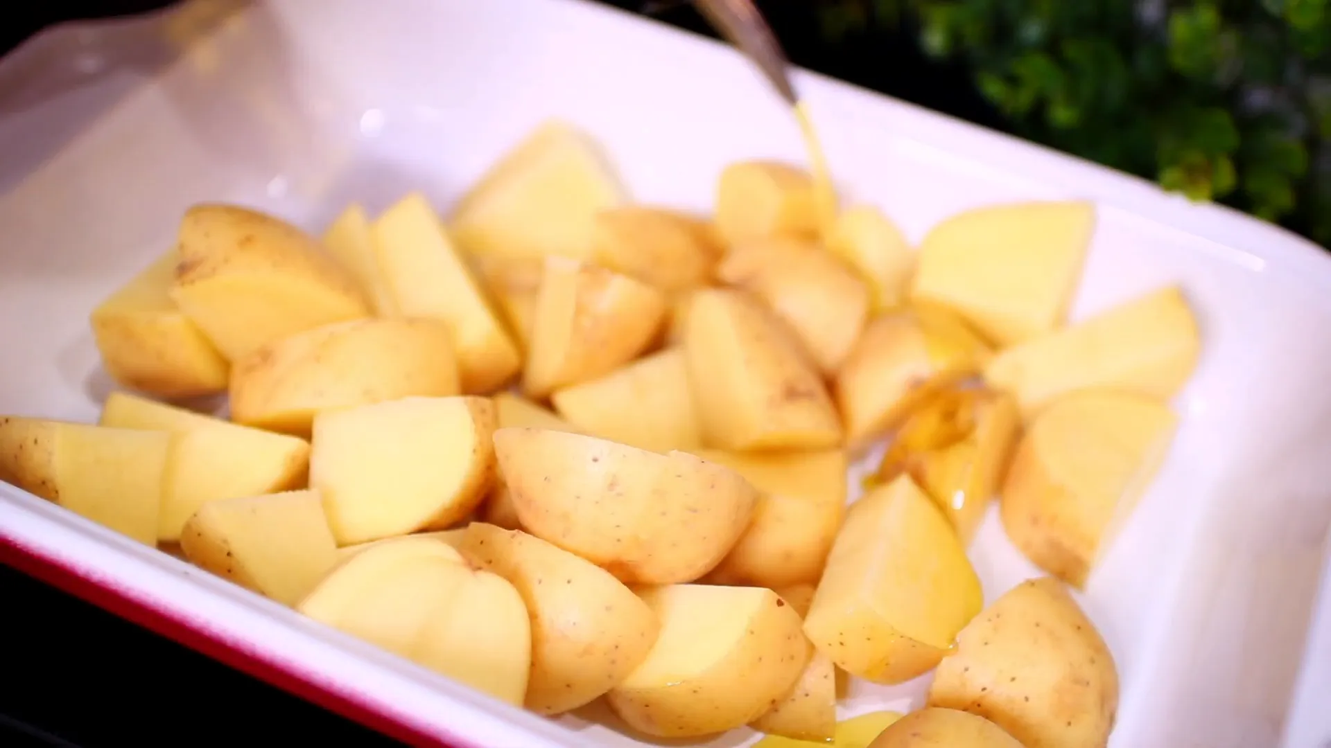 Transferring potatoes to baking pan