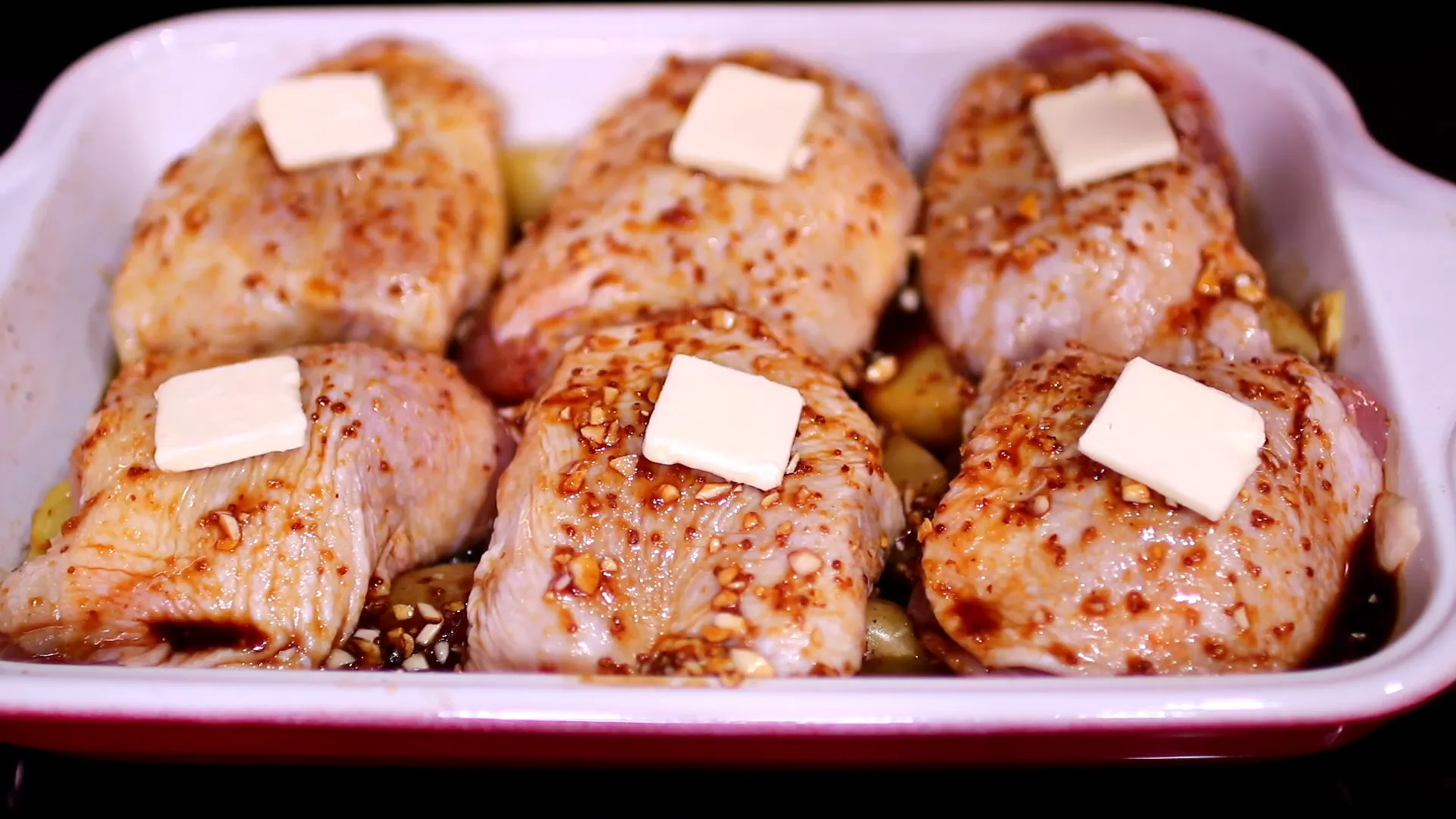 Adding butter to chicken thighs