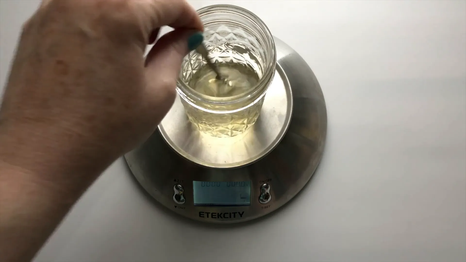 Mixing glycerin and honey into warm water