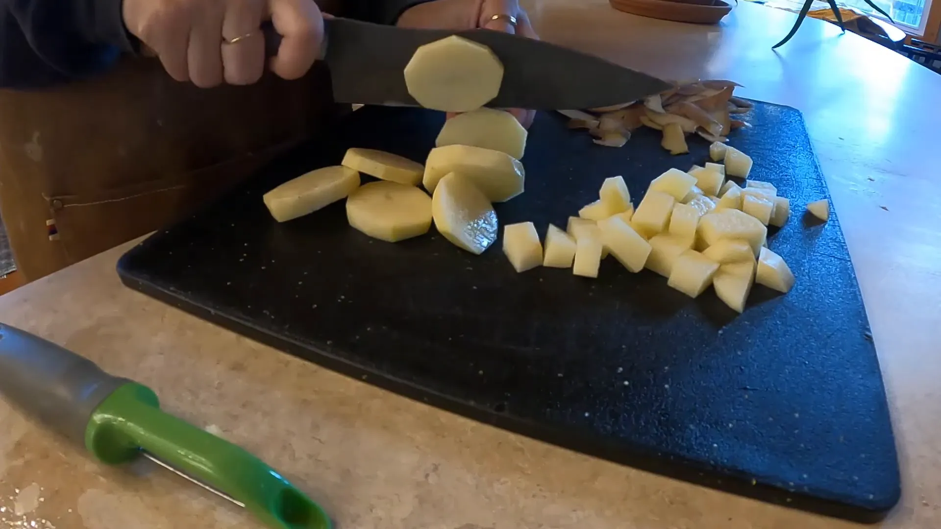 Preparing the potatoes for roasting.