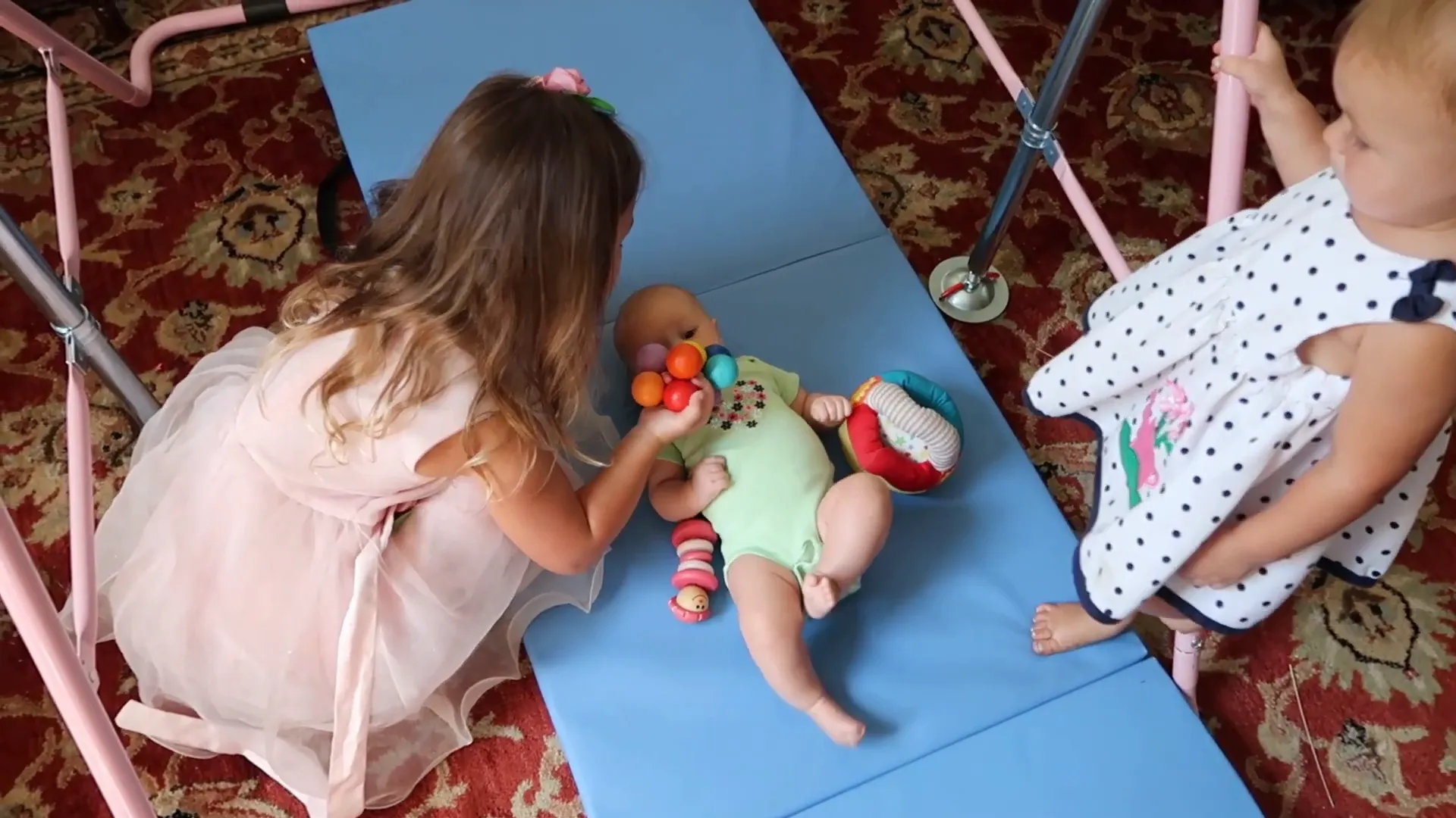 Using a baby play gym for entertainment