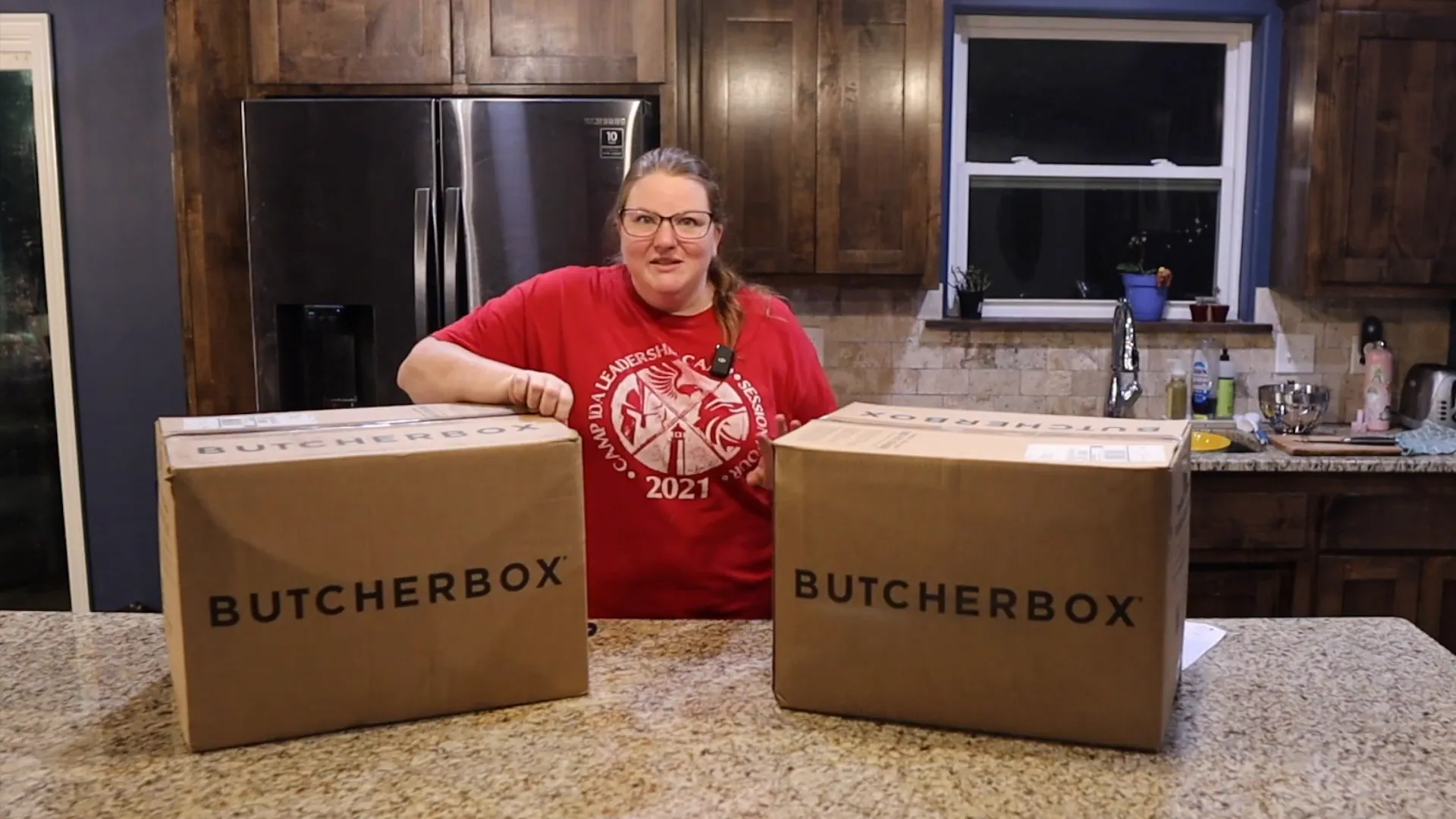 woman about to unbox two butcherbox meat boxes