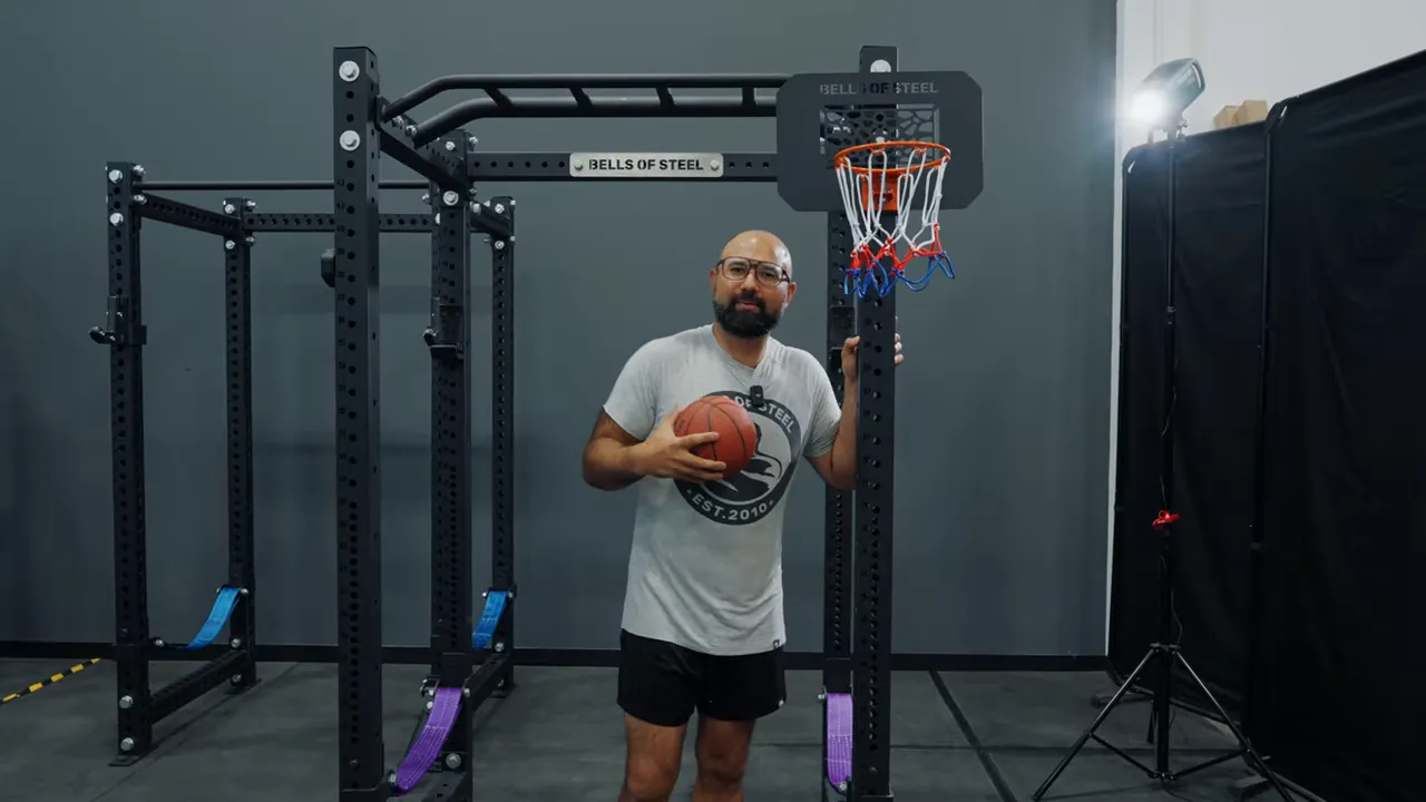 mini hoop and bracket next to a gym rack upright showing the side-mount context