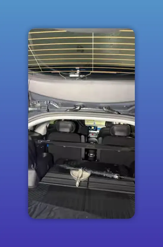 Rear camera mounted at top of rear window with defroster lines and hatch wiring visible on an Ioniq 9