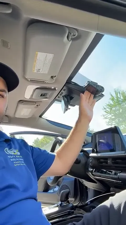 VOFO dash camera mounted on windshield behind rearview mirror