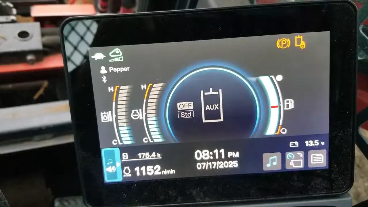 Off grid life - close view of machine display showing fuel gauge and operating information