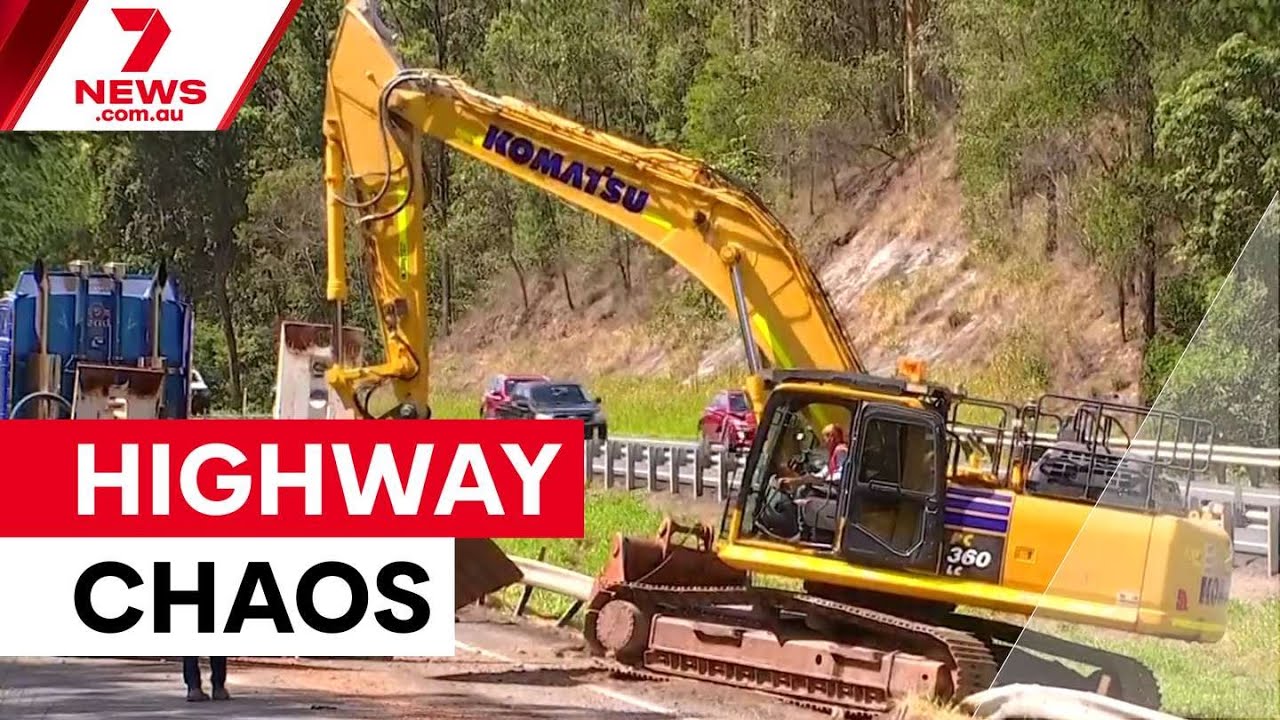 video thumbnail for 'Truck smashes into Bruce Highway overpass | 7NEWS'