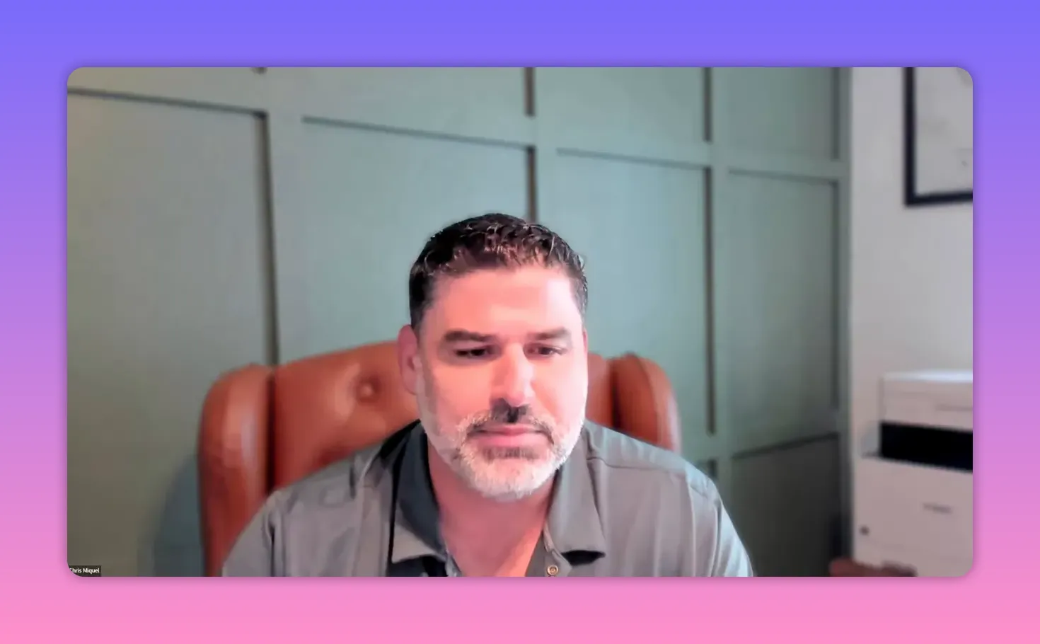 Clear video-call screenshot of a speaker in a home office, centered head-and-shoulders view, good lighting and sharpness.