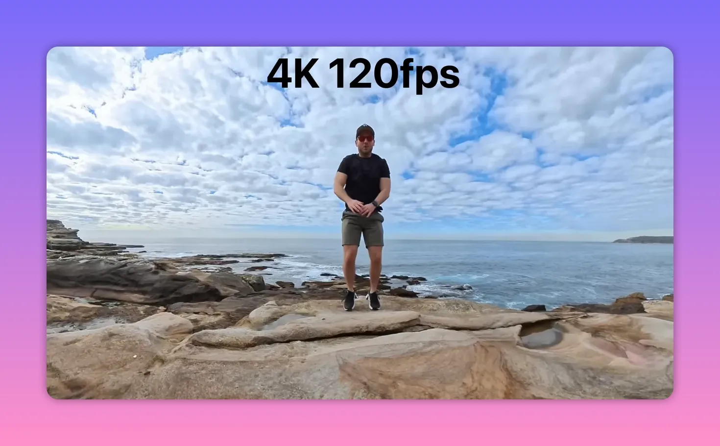 Wide coastal shot with a person jumping and large on-screen text reading '4K 120fps' indicating slow-motion mode.