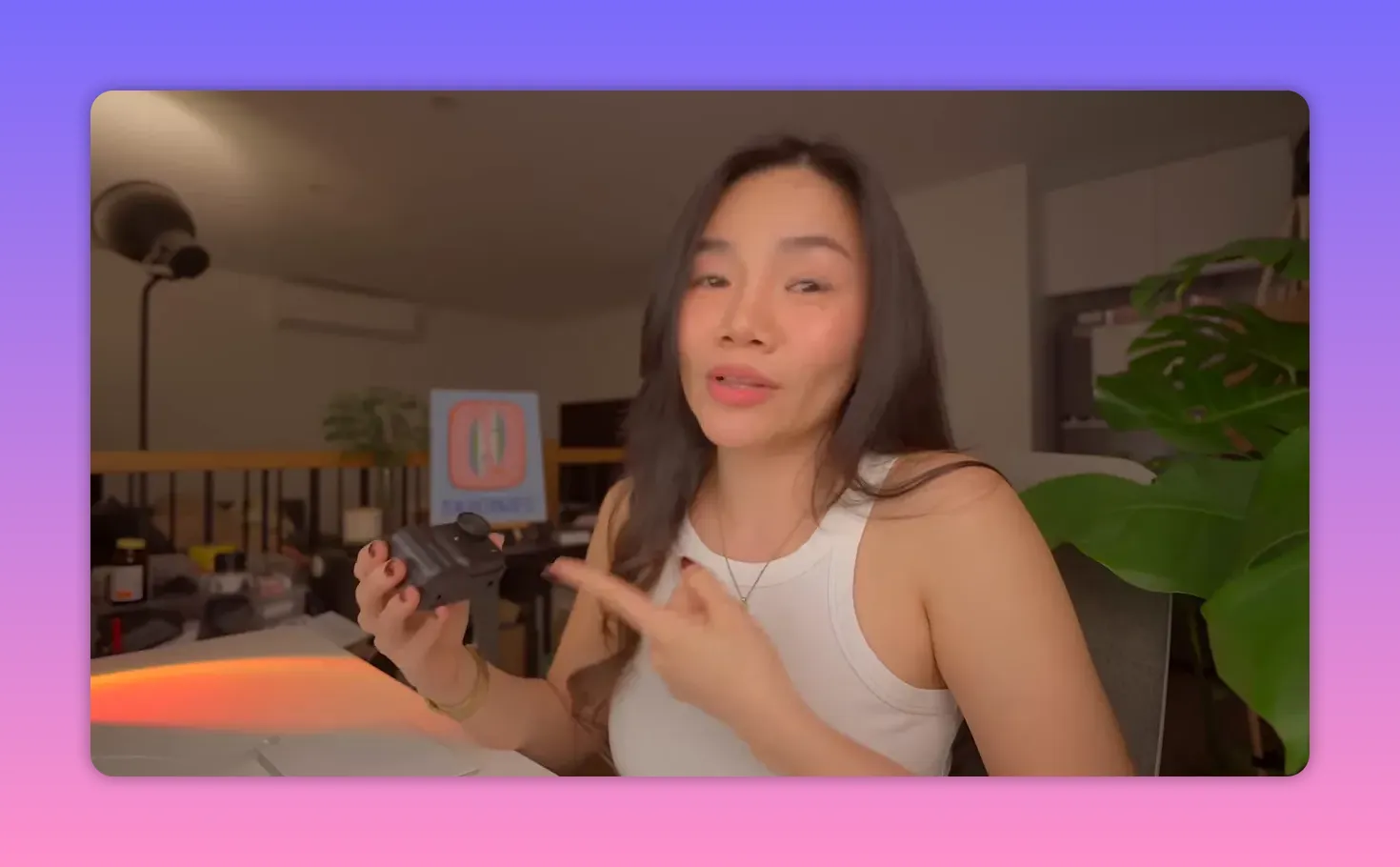 Presenter pointing to the X5 Ultra camera held in her hand