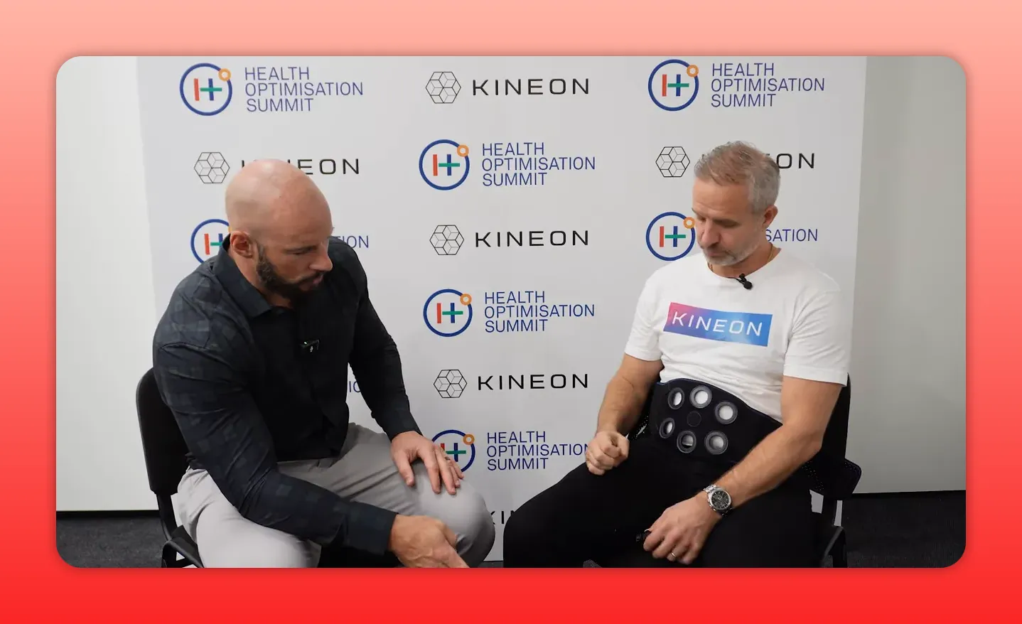 High-clarity image of Kineon Heel modular puck modules attached to a belt with a presenter holding the controller