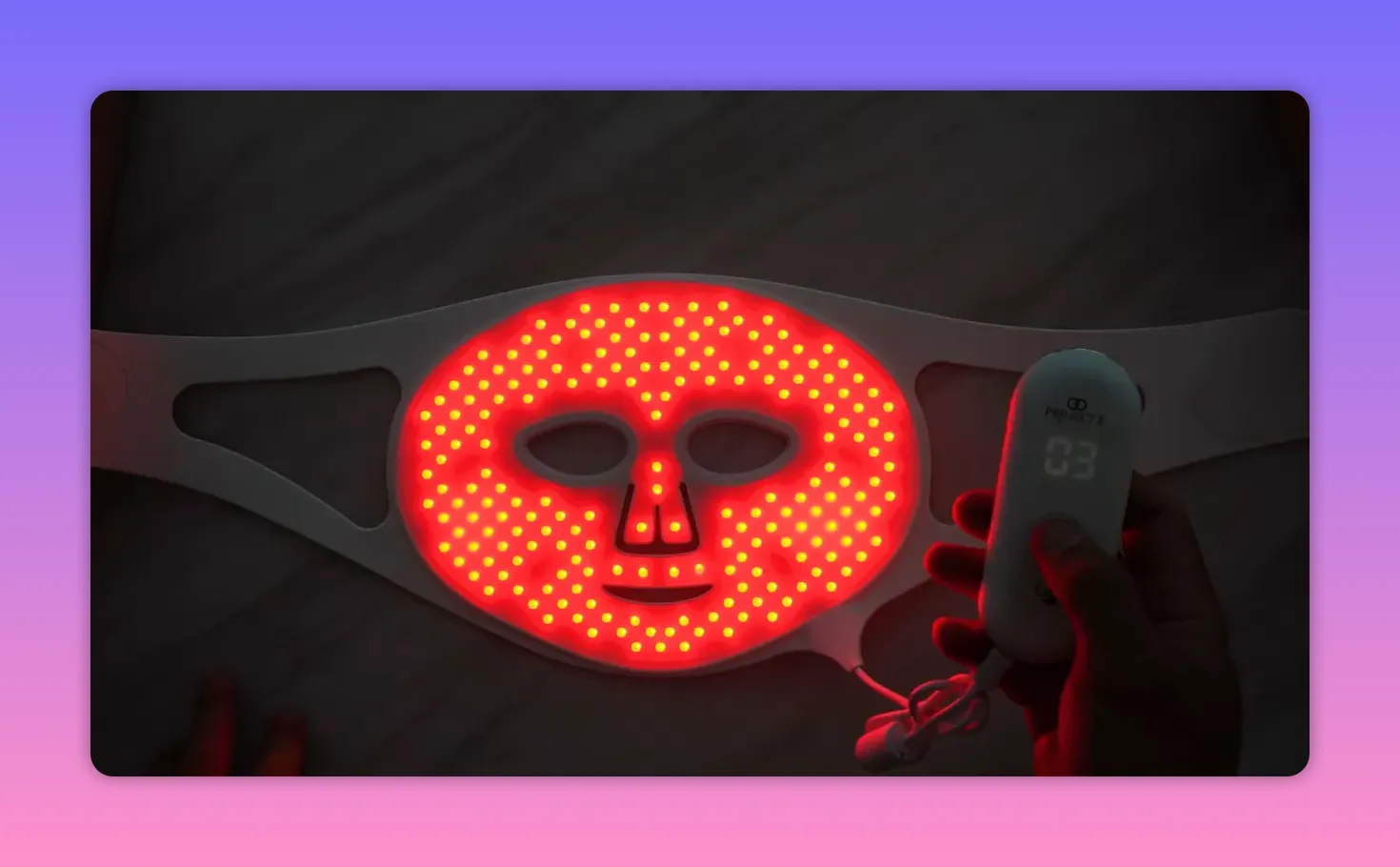 Project E Lumalux Pro LED face mask showing full red LED coverage with controller in view