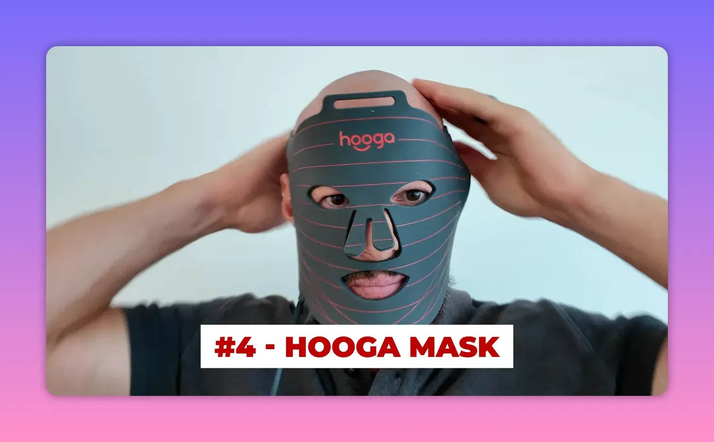 Front view of Hooga LED face mask being adjusted on the face, logo visible and mask centered.