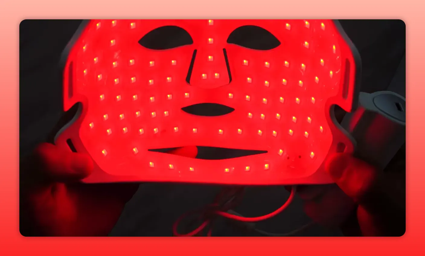 inside of a red light therapy facial mask showing dense grid of red LEDs and wiring
