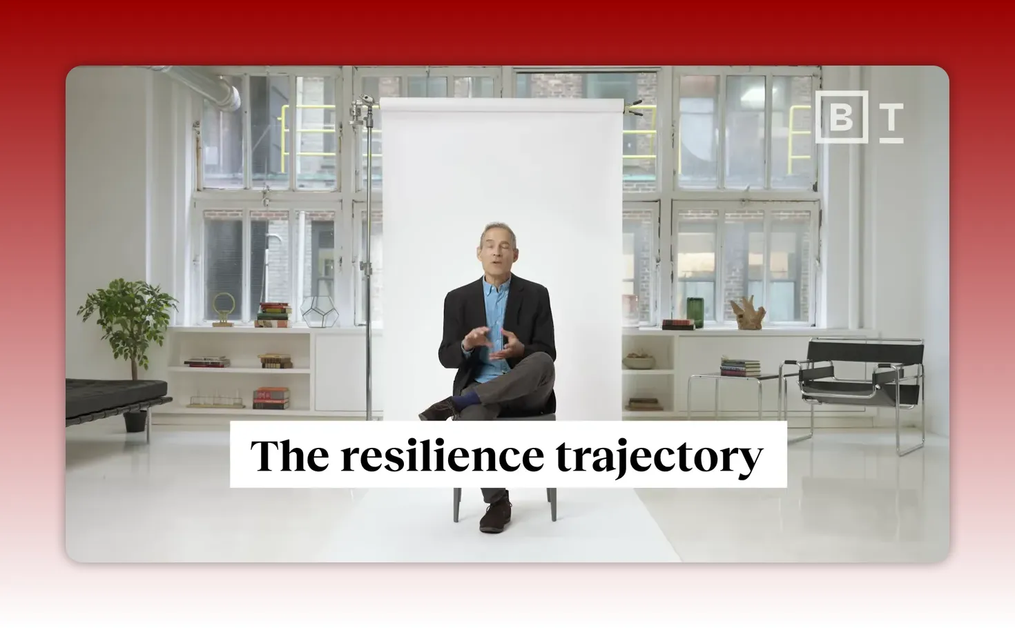 Title card overlay reading 'The resilience trajectory' with the speaker seated in a studio