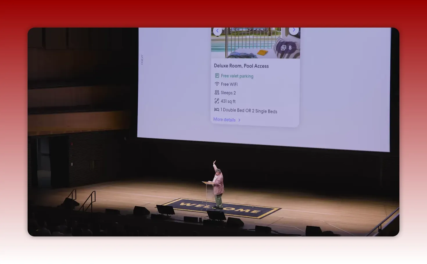 Projected slide showing a booking card titled 'Deluxe Room, Pool Access' with amenities listed