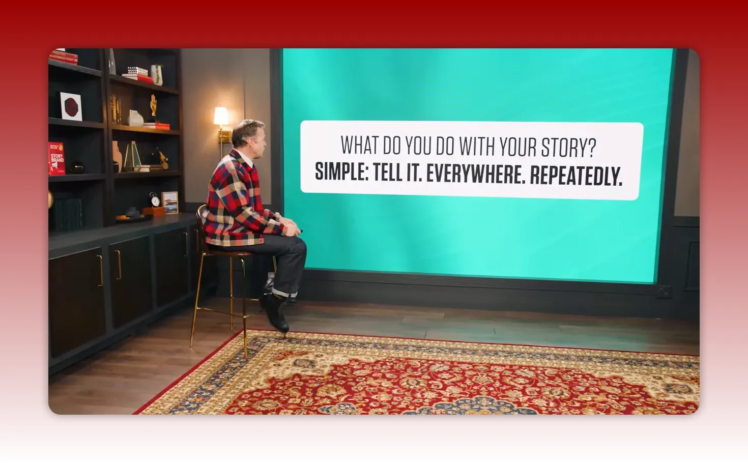 Presentation slide that reads 'WHAT DO YOU DO WITH YOUR STORY? SIMPLE: TELL IT. EVERYWHERE. REPEATEDLY.' with the presenter seated to the left.