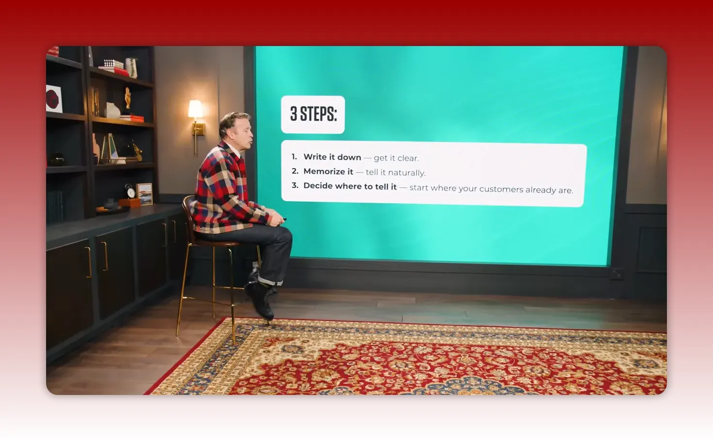 Presenter seated at left with a large teal screen at right showing '3 STEPS' and a white box listing: 1. Write it down; 2. Memorize it; 3. Decide where to tell it.