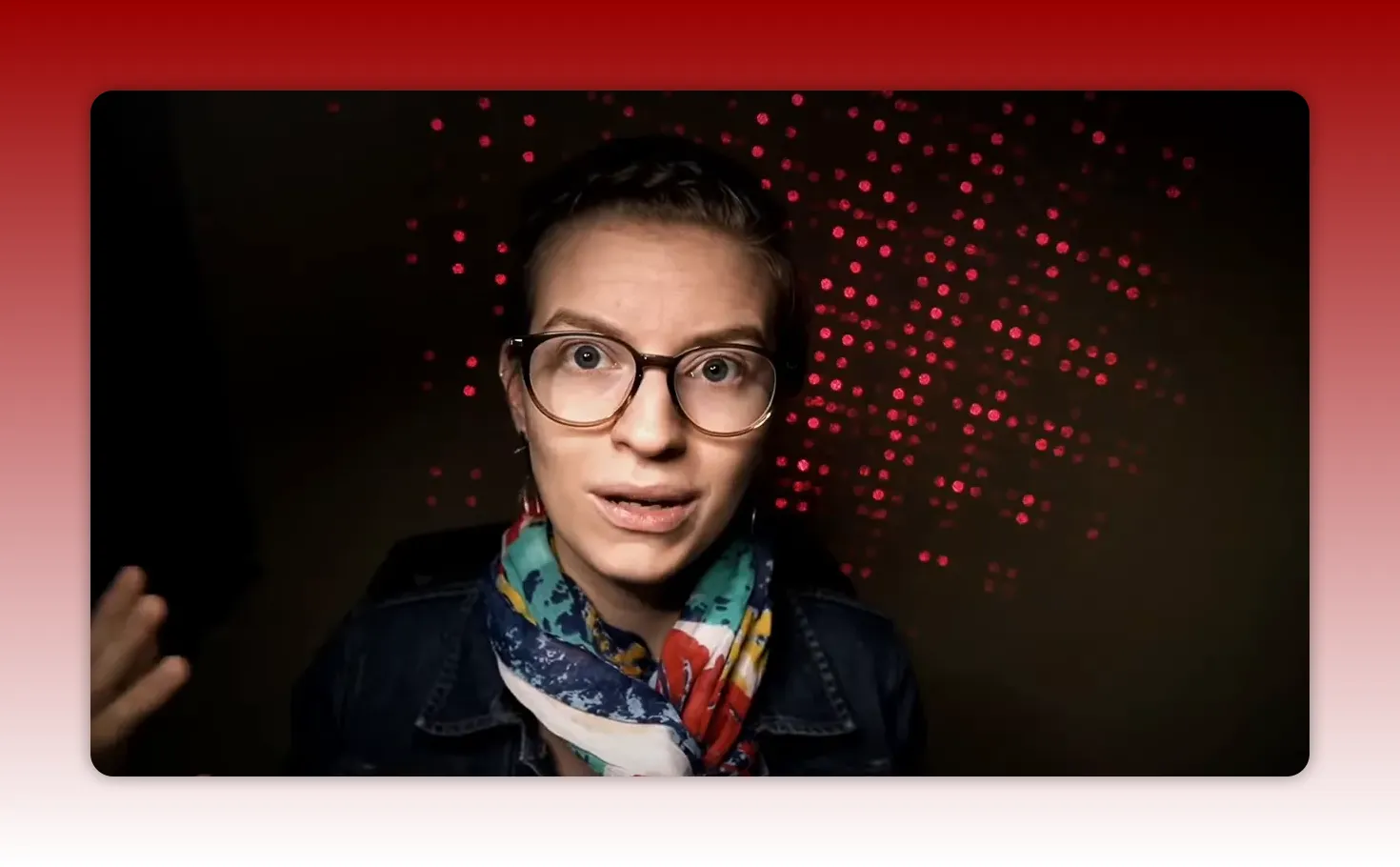 Presenter speaking about using technology to automate handoffs with red dotted background